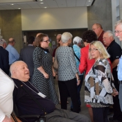 Retired faculty begin to assemble for a building tour.