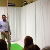 Dr. George Landon stands in front of white screens in Motion Capture Studio