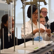 Drl Pei Gao demonstrates how acetone dissolves a styrofoam cup.