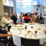 Retired Math, Computer Science, and Philosophy faculty seated at table.