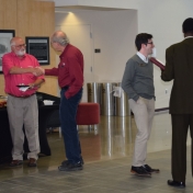 Faculty and staff enjoy chips and sandwiches at the reception