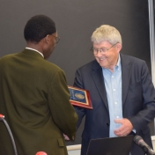 Dr. Tom Otieno presents Dr. Gary Booth with College of Science Award