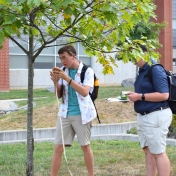 Model Lab students measure the length of a tree trunk