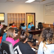 Dr. Donghui Quan talks about computational chemistry with students.