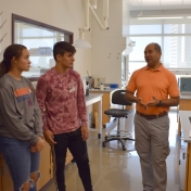 Dr. Karim Abdelhay talks with a group of students