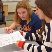 Two female students working on experiment