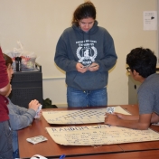 Math tutor, Shastina Bryant leads a probability game with Model students