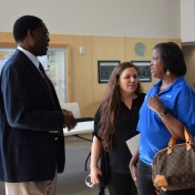 Dr. Tom Otieno visits with representatives from Novelis Corporation