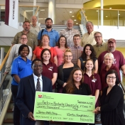 Science faculty and staff pose with reps from Novelis