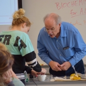 Dr. Martin Brock inspects students work.